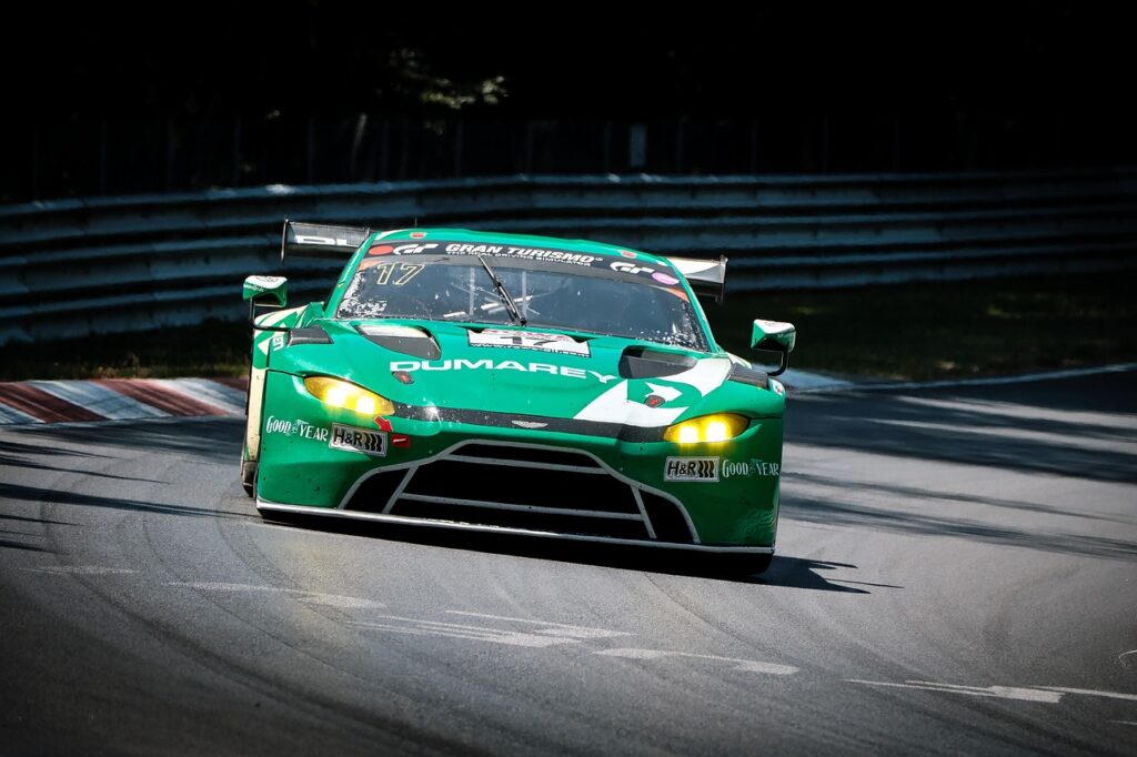 Race car speeding on a motorsport circuit