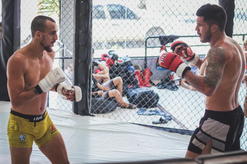MMA fighters sparring UFC octagon cage