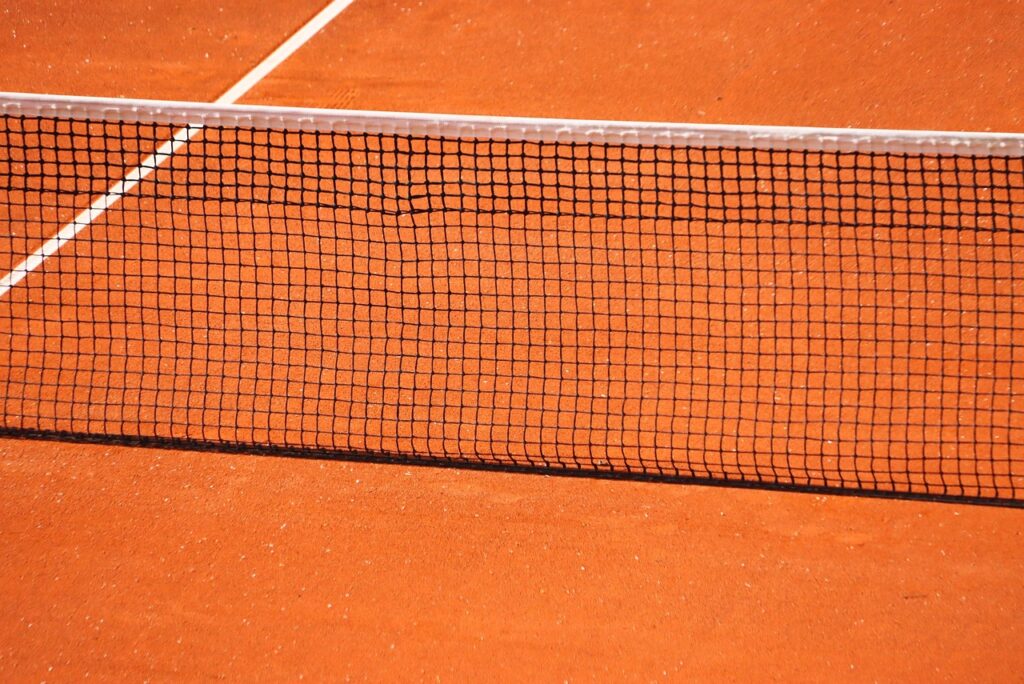 Tennis player on red clay court at Madrid Open 2026 — Alcaraz vs Sinner preview