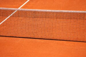 Tennis player on red clay court at Madrid Open 2026 — Alcaraz vs Sinner preview