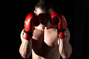 UFC fighter wearing gloves throwing a strike in combat sports action — ufc fight night 276 allen vs costa 2026 power rankings