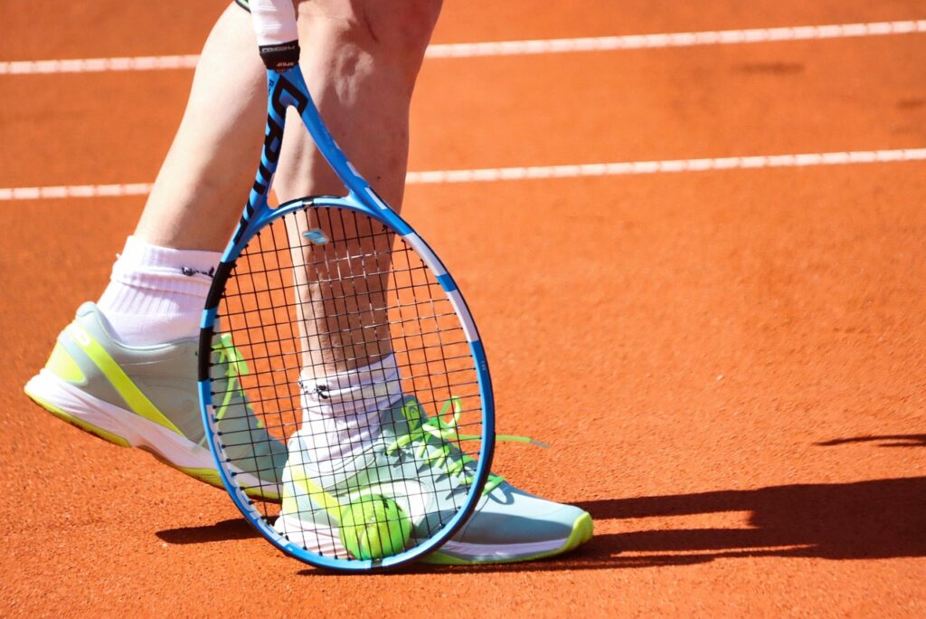 Tennis player clay court action shot Sinner Masters 1000 streak 2026